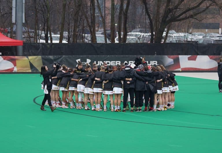 field hockey team huddle